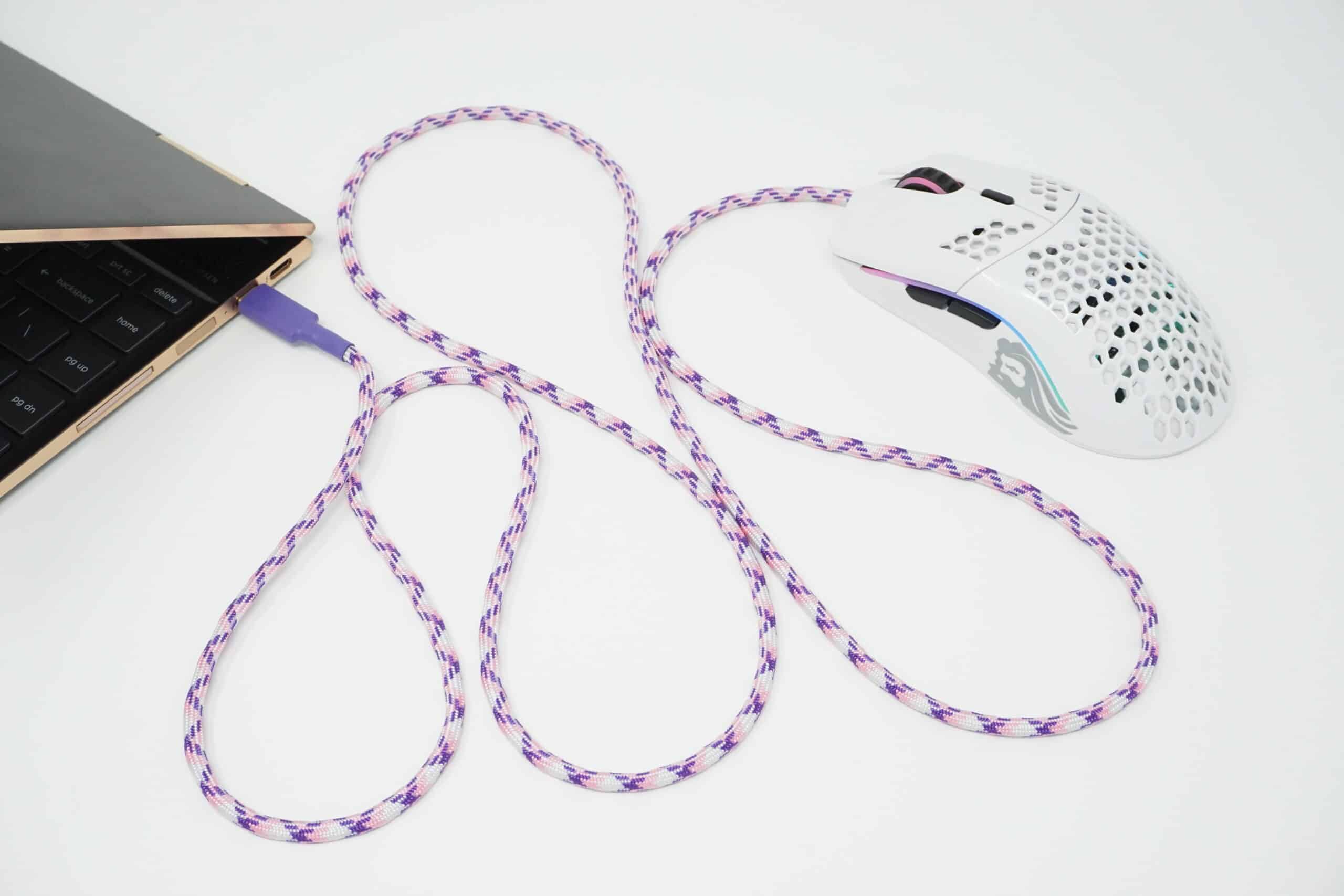 USB-C Mouse Paracord in white and purple installed into wired mouse plugged into laptop USB-C port