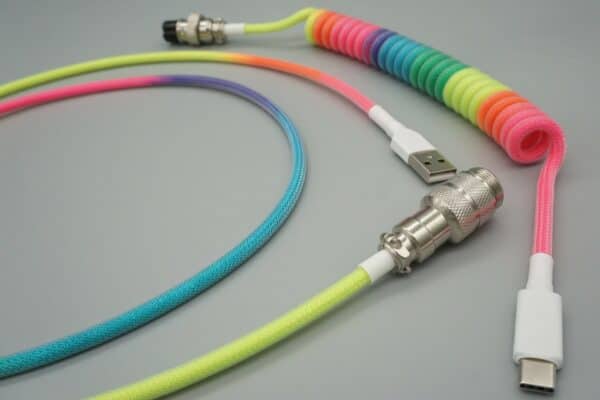 Close-up of Rainbow with white device-side coiled mechanical keyboard USB cable with 5-pin GX16 detachable connector