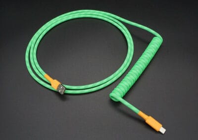 Mechanical keyboard USB cable in neon green with orange accents and a 6-inch coil