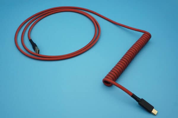 Mechanical keyboard cable in dark orange with a 6-inch coil